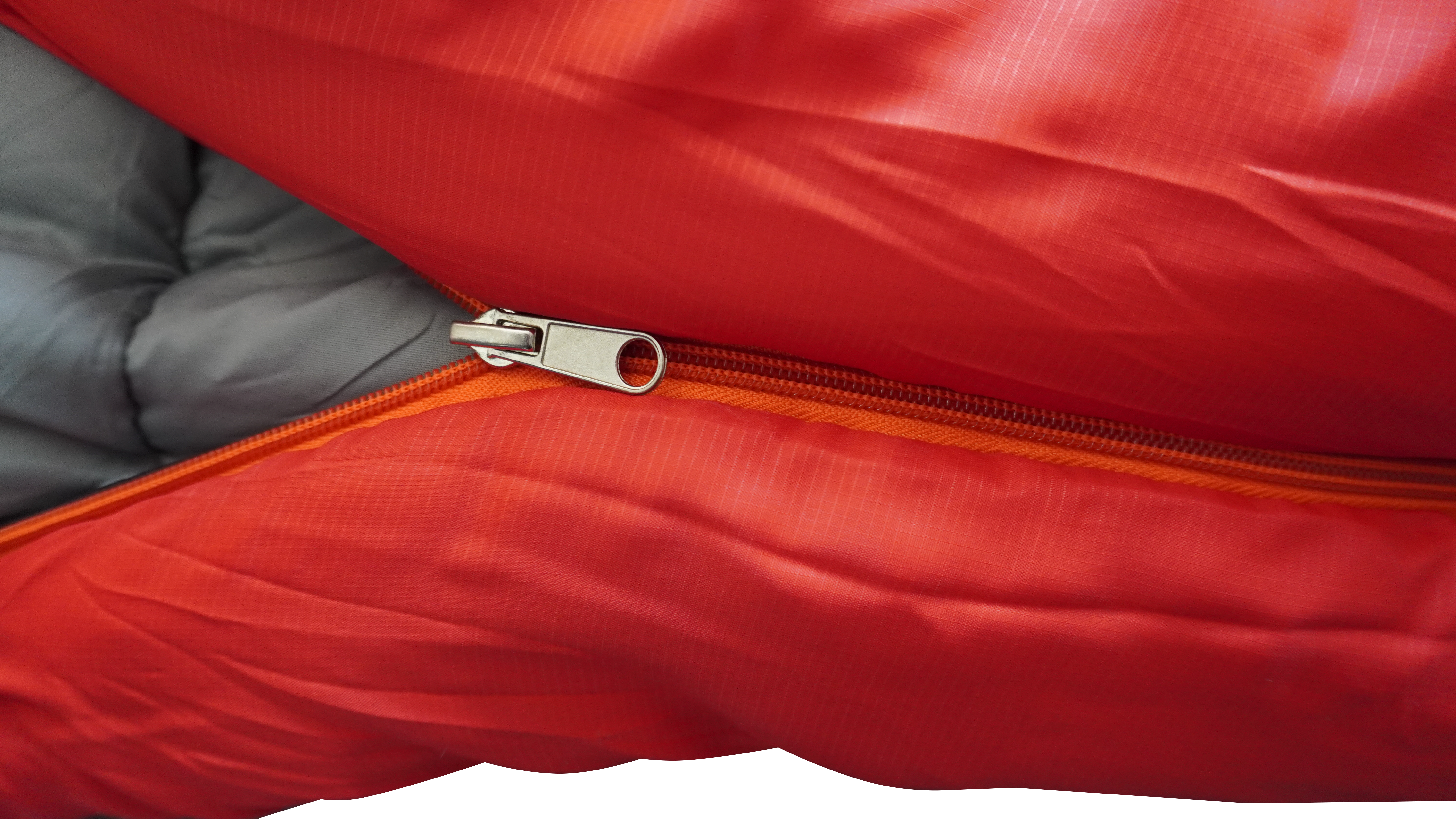 Orange close-fitting mummy sleeping bag